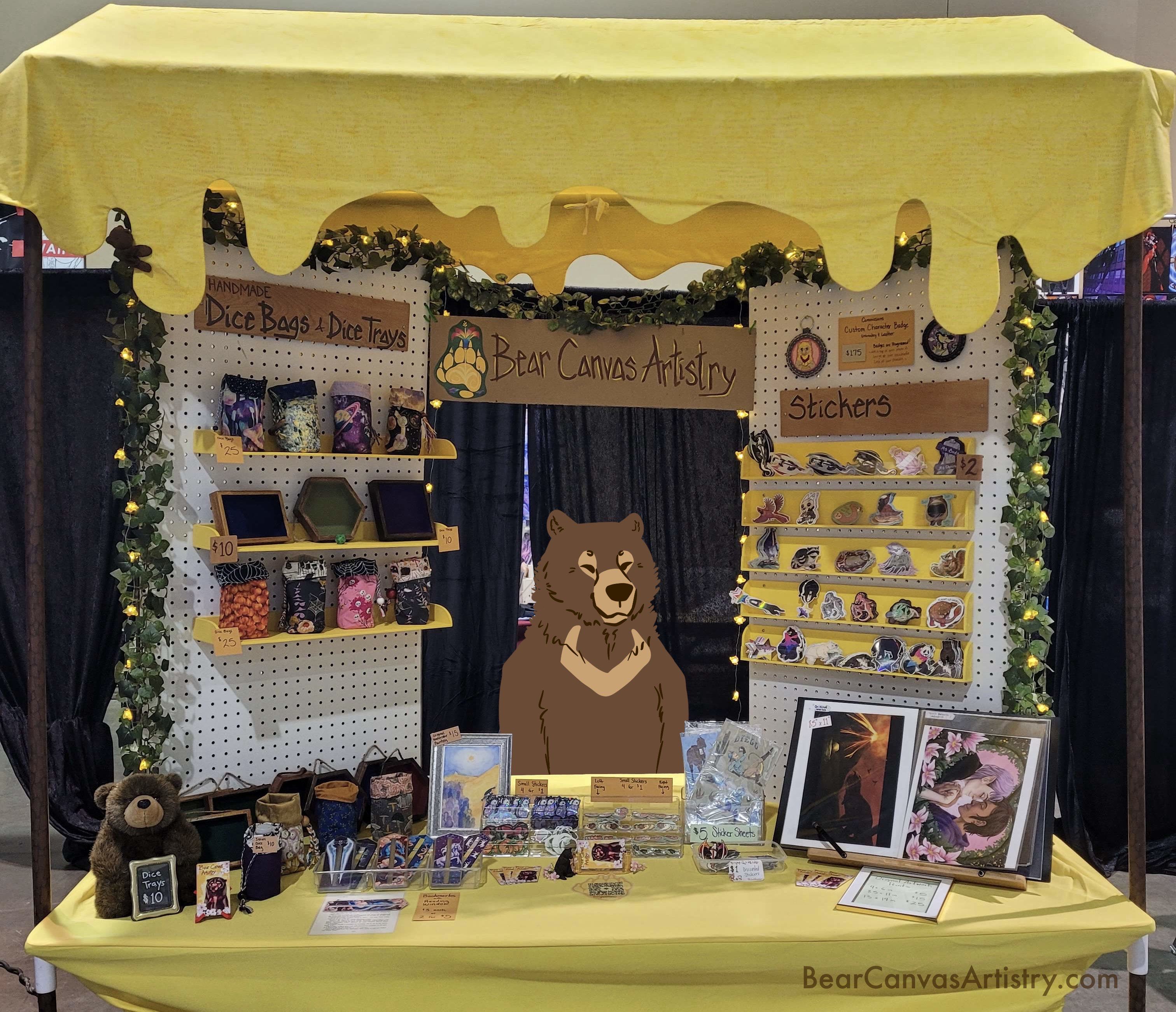 A picture of Bear Canvas Artistry's booth setup.